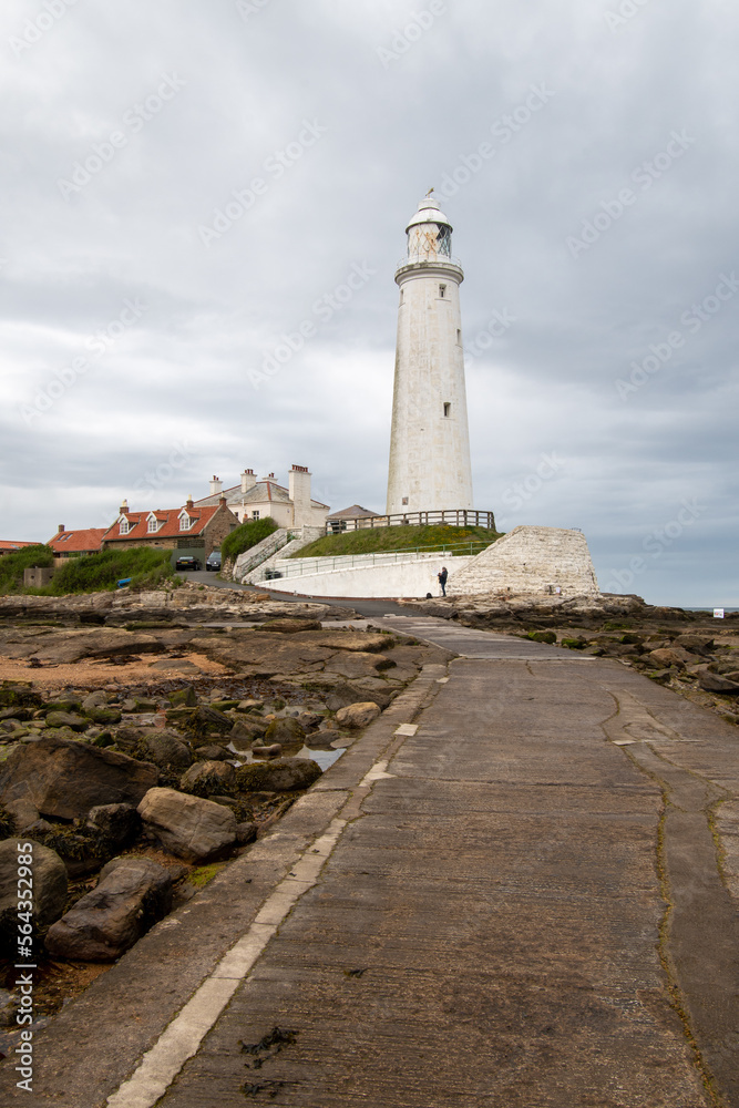 Dark cloudy skies over St Mary's LIghthouse at Whitley Bay in Tyne and Wear, UK