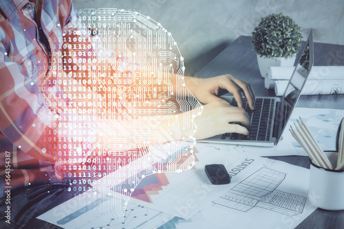 Man with computer background with brain theme hologram. Concept of brainstorm. Double exposure.