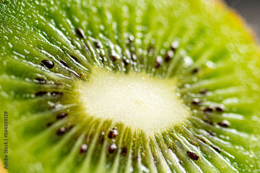 A slice of ripe kiwi. Macro background. A slice of ripe kiwi. Macro background.