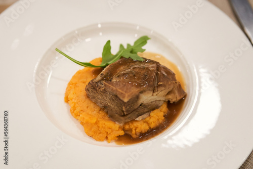tasty ready-to-eat dish of iberian secreto iberico with sobrasada parmentier and vermouth sauce