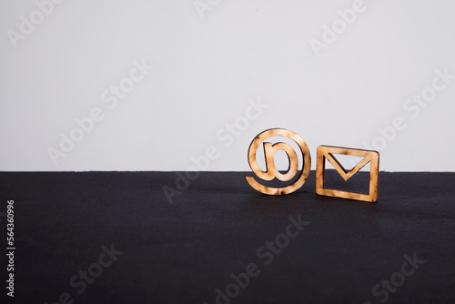 Wooden icon of mail and email address on the table