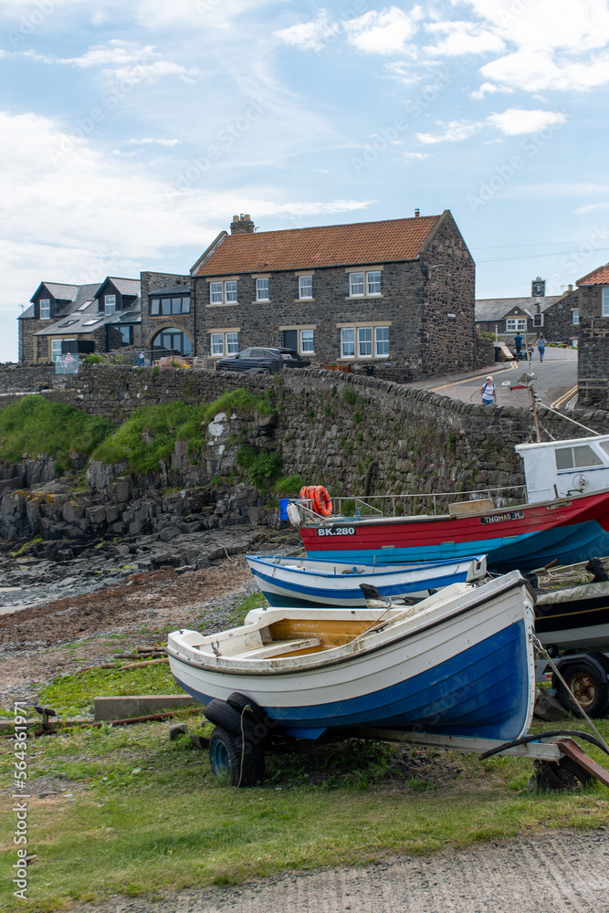 Boats docked at Craster harbour in Northumberland, UK Boats docked at Craster harbour in Northumberland, UK