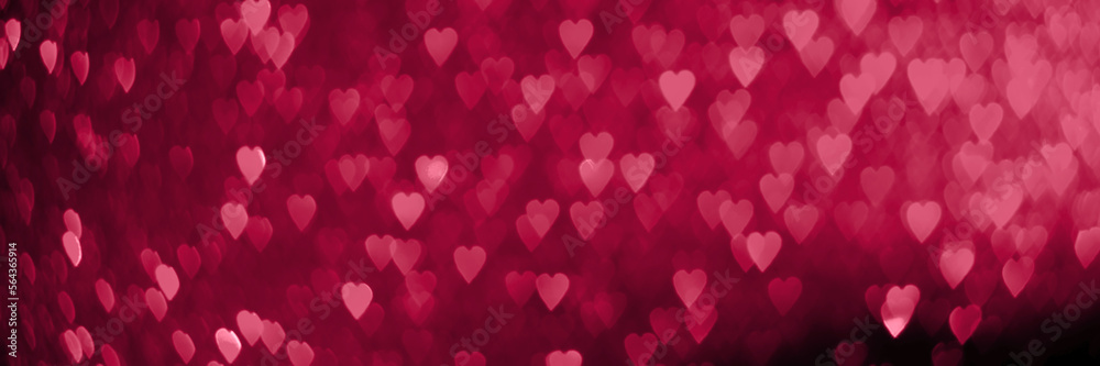 Trendy viva magenta, pink red hearts, sparkling glitter bokeh panoramic background banner, valentines day abstract defocused texture header. Color of the year 2023