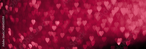 Trendy viva magenta  pink red hearts  sparkling glitter bokeh panoramic background banner  valentines day abstract defocused texture header. Color of the year 2023