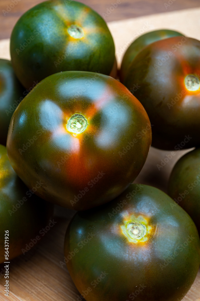 Fresh ripe sweet reddish brown and green kumato tomatoes Fresh ripe sweet reddish brown and green kumato tomatoes