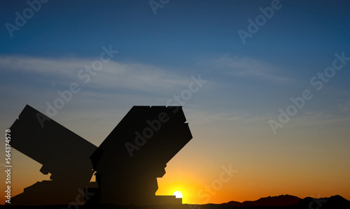 Silhouette of air defence against the sunset. Rocket launcher aimed at sky. EPS10 vector