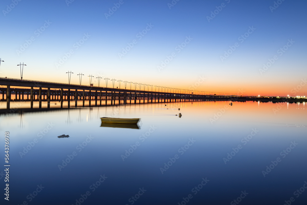 Long time exposure photograph of the Puente del Odiel or Puente-Sifón Santa Eulalia at sunset in Huelva, Andalusia, Spain