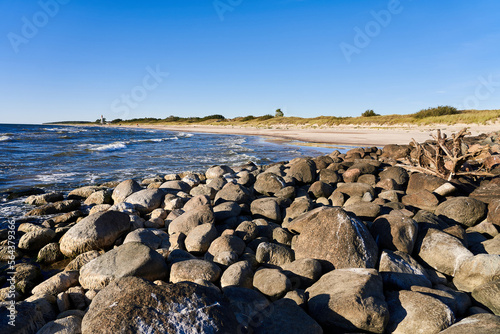 The Baltic Sea in calm weather. Coastline with a breakwater near the town of Nida in Latvia