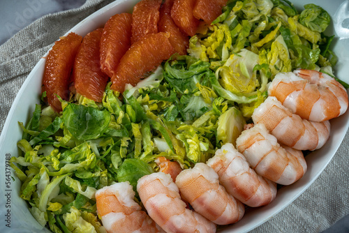 Winter salad: Shredded brussels sprouts salad with poached shrimp and orange supremes.
