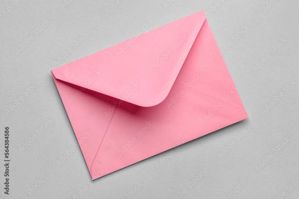 Pink paper envelope on light background Pink paper envelope on light background