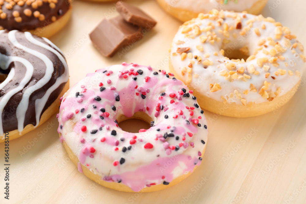 Wooden board of delicious donuts, closeup Wooden board of delicious donuts, closeup