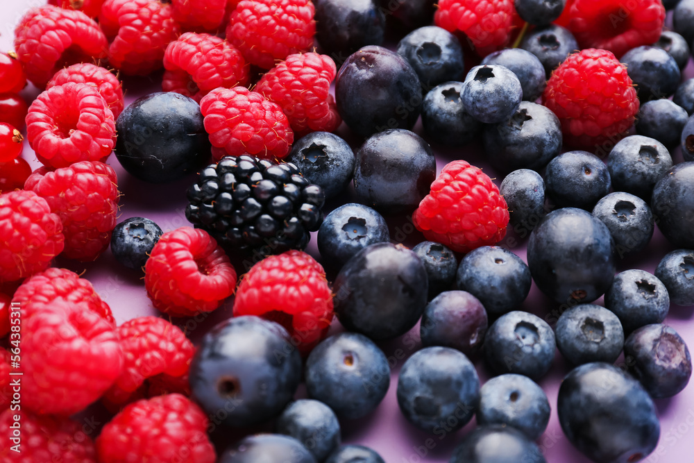 Heap of fresh ripe berries on color background, closeup Heap of fresh ripe berries on color background, closeup
