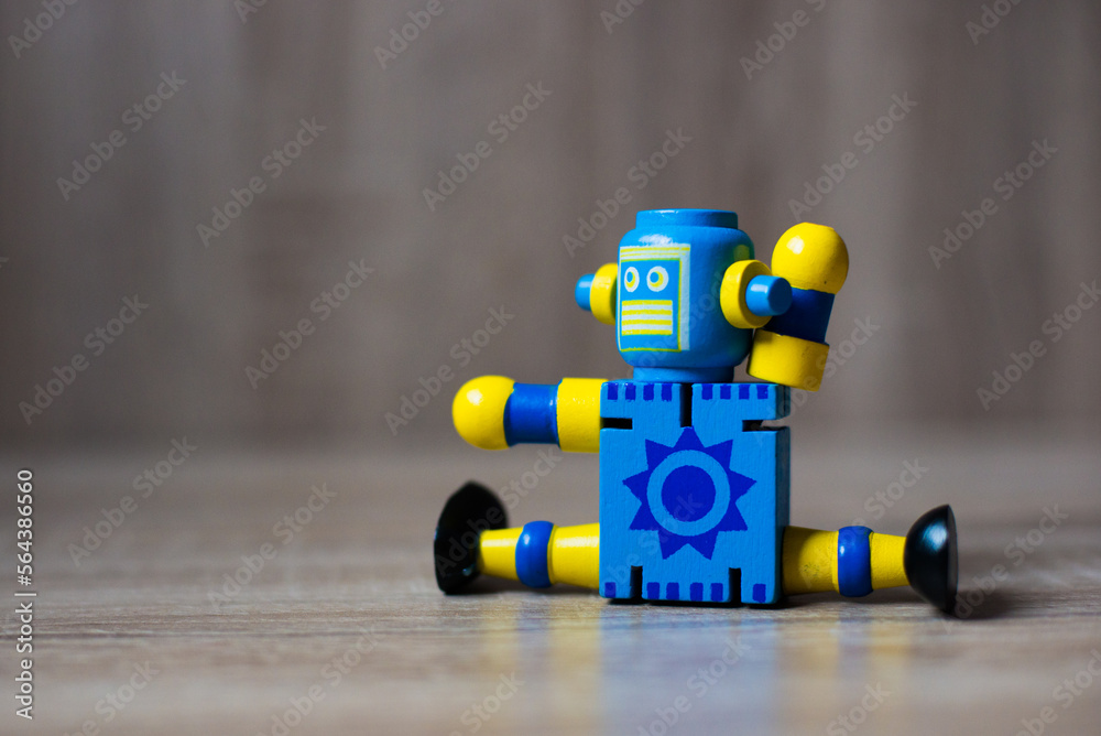 Fototapeta premium robot toy standing on wooden floor