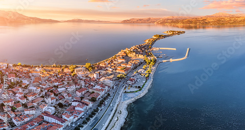 Aerial sunset view of Egirdir lake peninsula and town in Isparta region. Calm turquoise and scenic coast of national park in Turkey photo