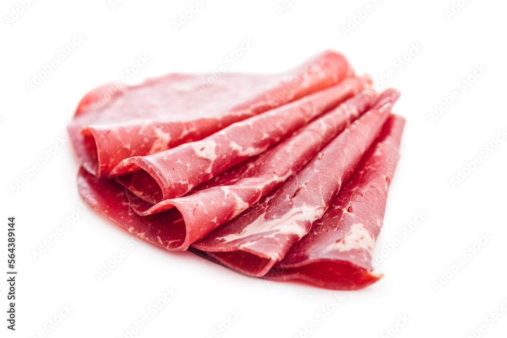 Smoked bresaola. Italian appetizer. Dried beef meat isolated on white backgorund.