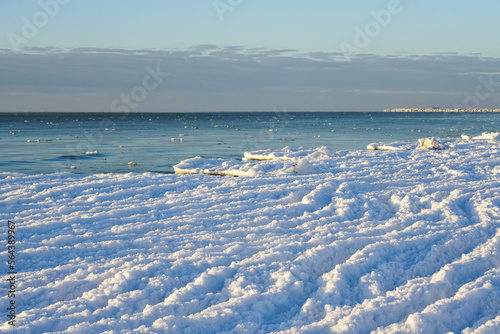 Fototapeta Naklejka Na Ścianę i Meble -  Ice formation on the coast of the Baltic Sea, water waves turning into ice waves due to strong frost