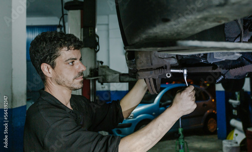 Repairman installing brake discs in workshop