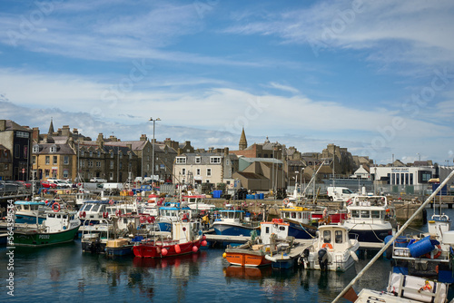 A busy harbour in a Scottish town