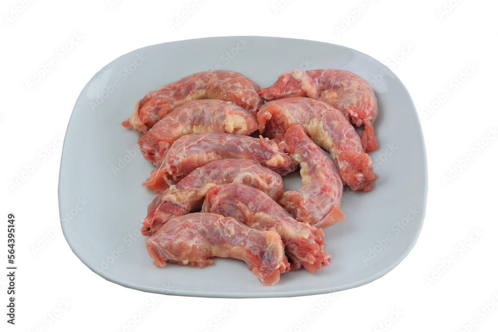 Chicken necks in plate isolated on white background. Raw meat for cooking. Chicken necks in plate isolated on white background. Raw meat for cooking.