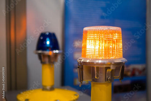 Close up of alarm lamp signal warning flashing lights for industrial machinery at emergency, support and services exhibition. Danger, legal, alert light, attention, hazard, manufacturing concept