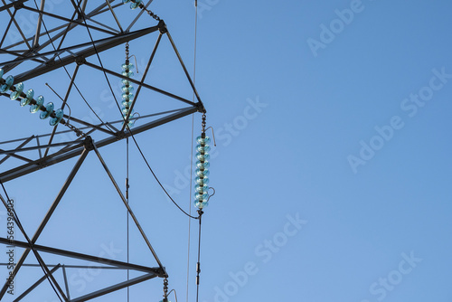 Electircity pylons against a clear blue sky on a cold winters day in staffordshire photo