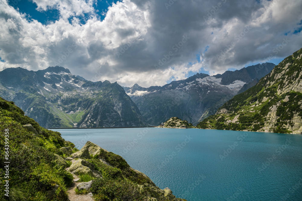 Walking trail around beautiful Gelmersee lake in Switzerland