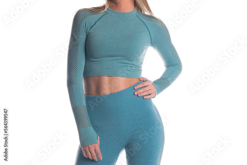 Blonde female in light blue workout top and bottom with a white backdrop