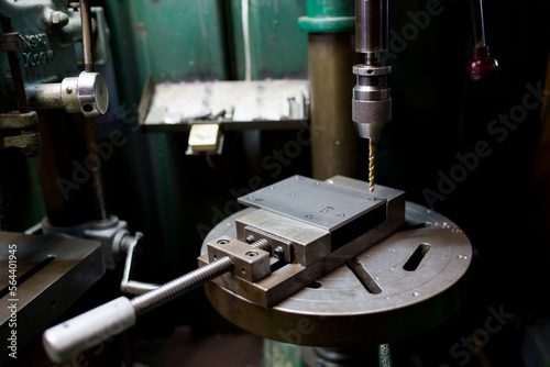 Part machining with drilling machine