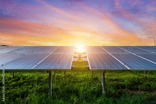Obraz na płótnie Photovoltaic modules solar power plant on dramatic sunset sky background,clean Alternative power energy concept. w salonie