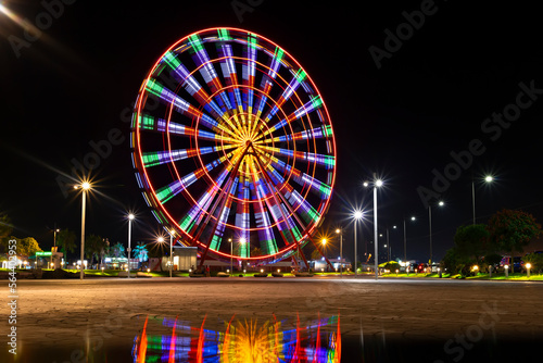 Batumi, Georgia. Ferris wheel on the embankment at night, motion blur filmed