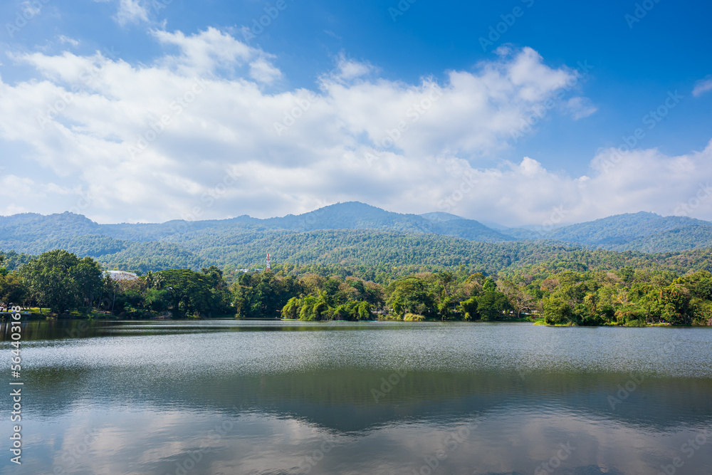 a public place leisure travel landscape lake views at Ang Kaew Chiang Mai University and Doi Suthep nature forest Mountain views spring cloudy sky background with white cloud.