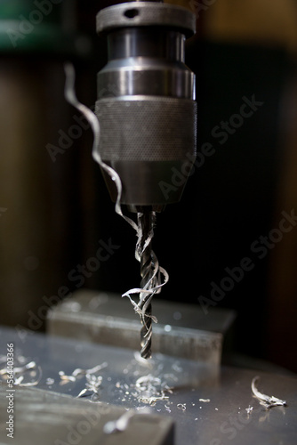 Part machining with drilling machine
