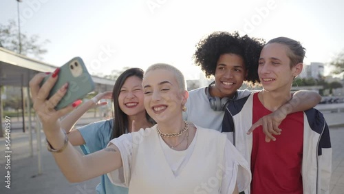 Happy centennial people taking smiling selfie. Group of students together at campus university . High quality photo