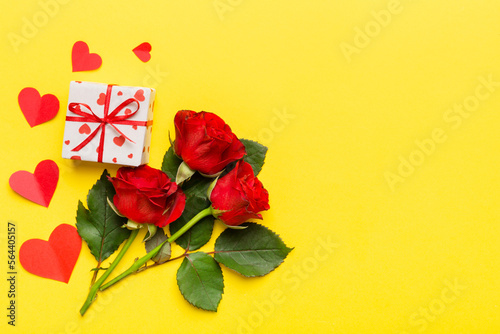 Valentine s day composition with rose flower  red heart and gift boxes on table. mother day and birthday greeting  copy space  top view