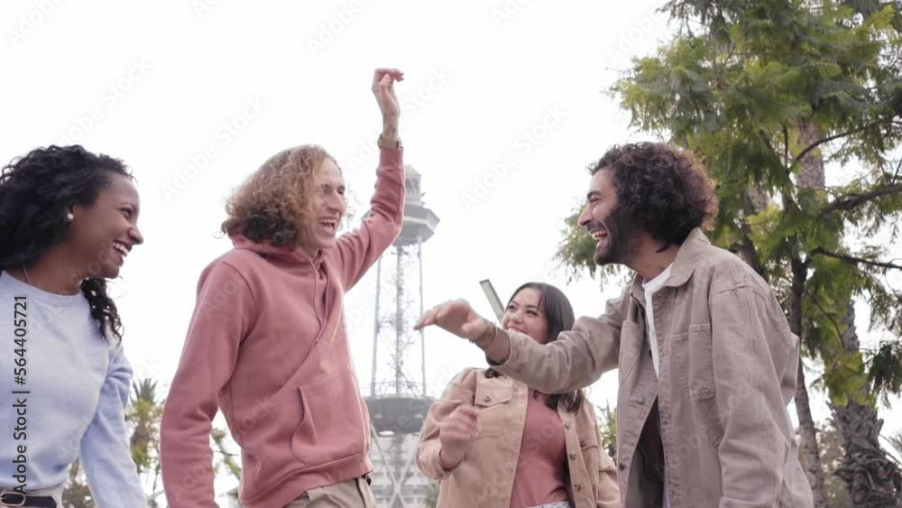 Group of young entrepreneur team stacking hands outdoors and looking at the camera. High quality photo
