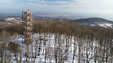 Aerial view of wooden lookout tower on the top of Velka Homola in winter, Male Karpaty, Slovakia