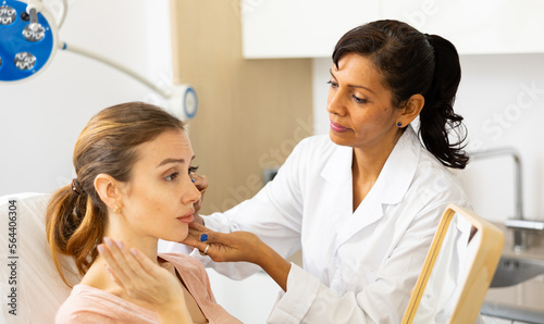 Wallpaper Mural Woman cosmetologist and female client examining face skin after cosmetology beauty treatment at esthetic clinic Torontodigital.ca