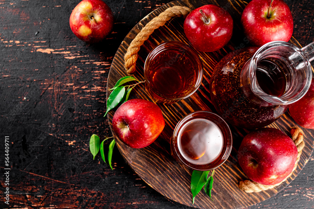 Apple juice on a wooden tray. Apple juice on a wooden tray.