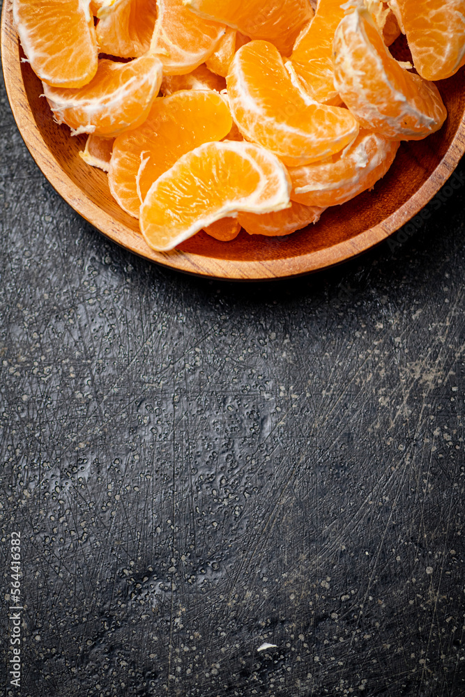 Peeled fresh tangerines. On a black background. Peeled fresh tangerines. On a black background.
