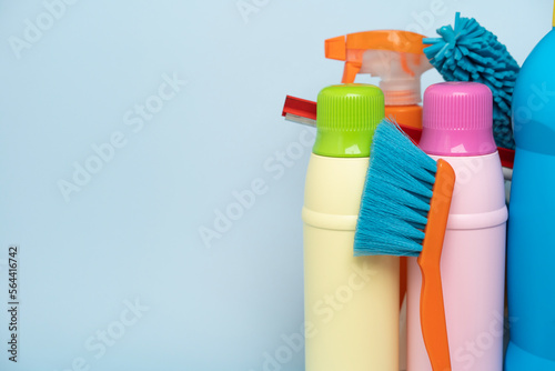 House cleaning plastic product on blue table background, home service or housekeeping concept