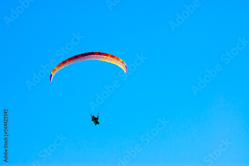 paraglider against the blue sky