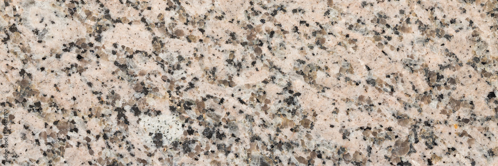 Granite texture. Natural granite with a grainy pattern. Stone background. Solid rough surface of rock. Durable construction and decoration material. Close-up. Granite texture. Natural granite with a grainy pattern. Stone background. Solid rough surface of rock. Durable construction and decoration material. Close-up.