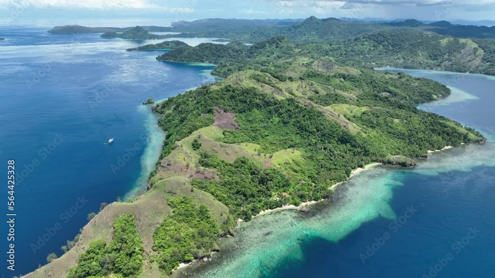 Healthy coral reefs fringe a lush island in the Solomon Islands. This beautiful, tropical country is home to spectacular marine biodiversity and many historic WWII sites. Healthy coral reefs fringe a lush island in the Solomon Islands. This beautiful, tropical country is home to spectacular marine biodiversity and many historic WWII sites.