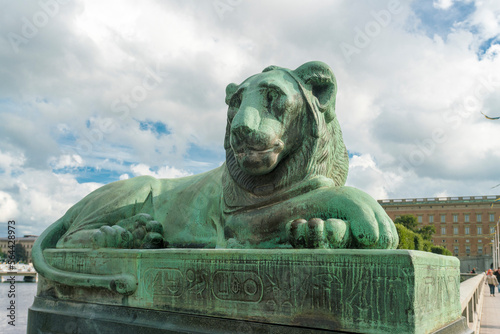 lion bronze statue on norrbro bridge in Stockholm by the Swedish parliament photo