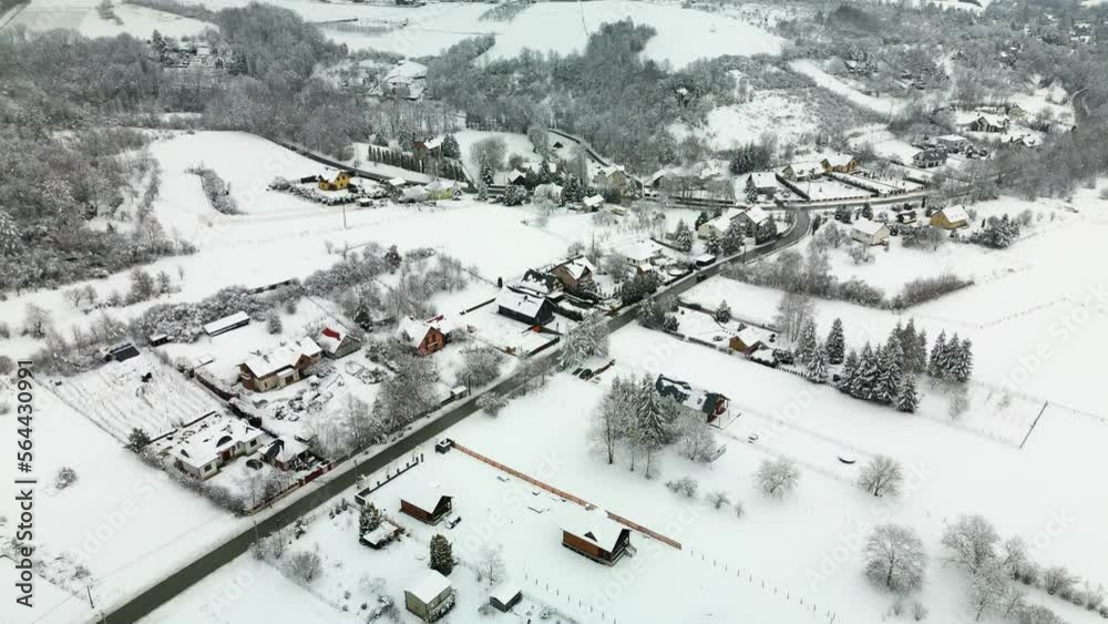 Aerial flight over the village in Poland during winter with lots of snow. Aerial flight over the village in Poland during winter with lots of snow.