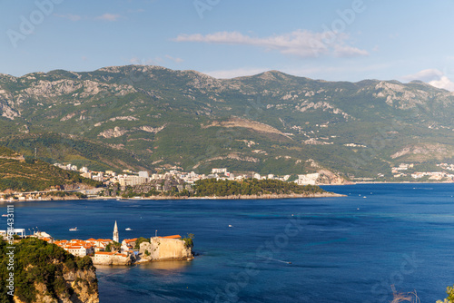 Bird's eye view of towns of Budva and Becici with hotels and beaches near Adriatic Sea against the backdrop of the Montenegrin Mountains