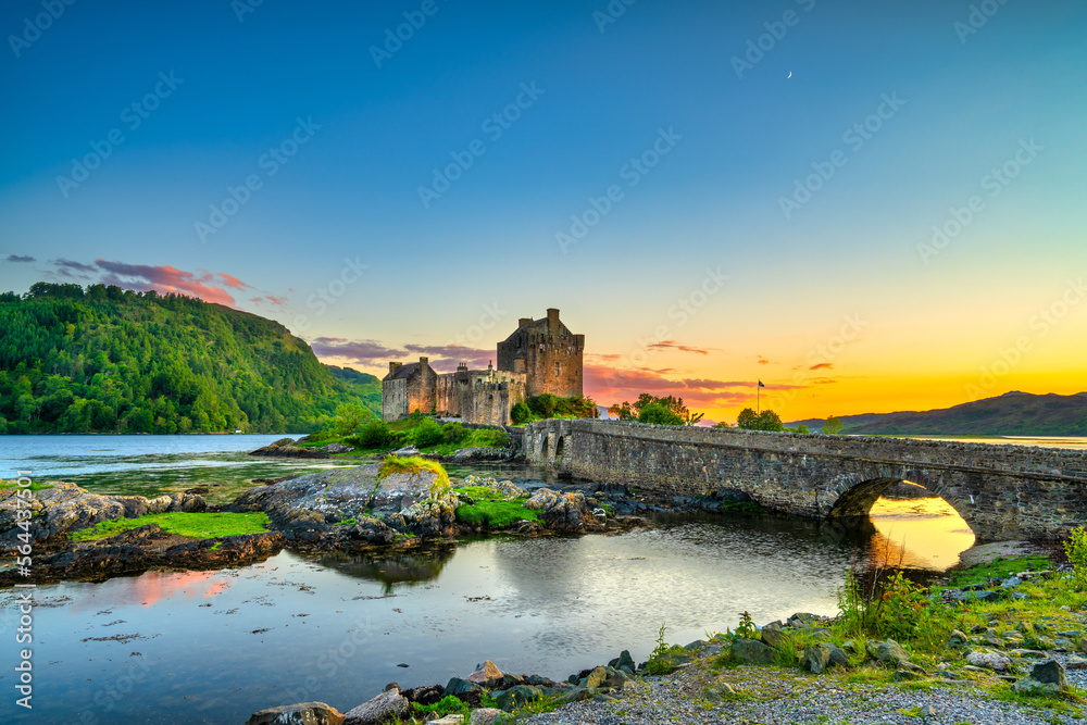 Eilean Donan Castle at sunset in Scotland