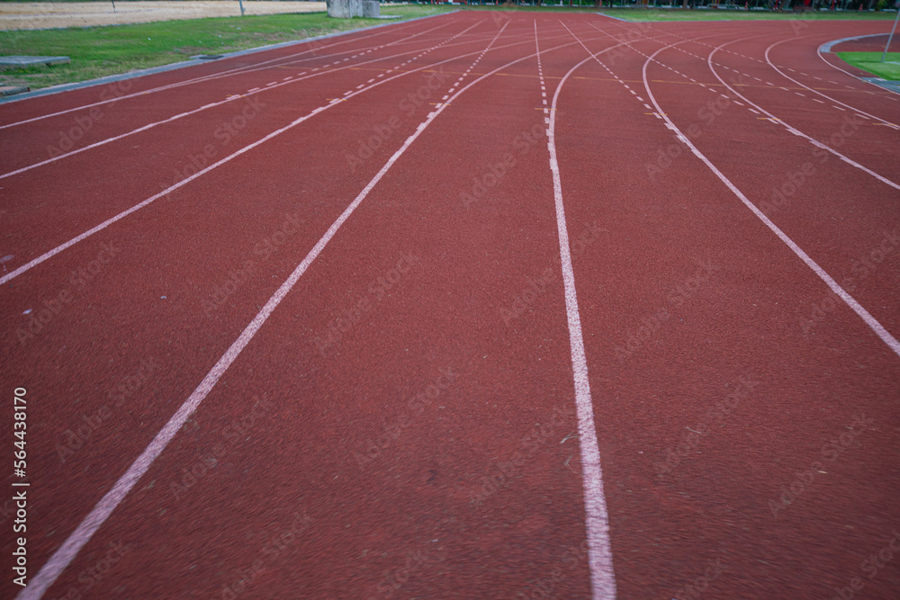 Empty fast running lane in outdoor sport stadium