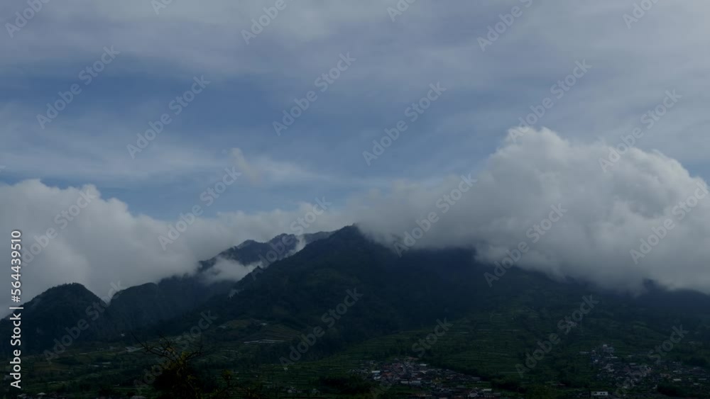 Time lapse of the movement of clouds over the village of residents on the northern slope of Mount Merapi, Central Java Time lapse of the movement of clouds over the village of residents on the northern slope of Mount Merapi, Central Java