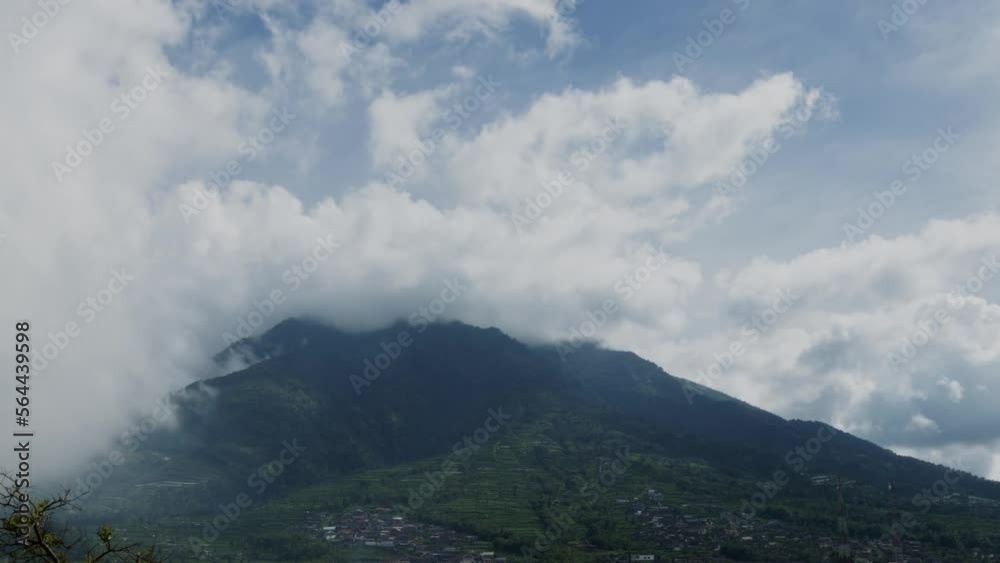 Time lapse of the movement of clouds over the village of residents on the northern slope of Mount Merapi, Central Java Time lapse of the movement of clouds over the village of residents on the northern slope of Mount Merapi, Central Java